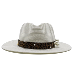 Straw sun hat with leopard ribbon and pearl embellishments in classic panama style