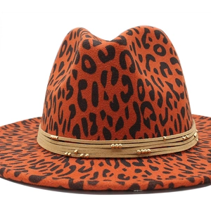 Detail of wide brim leopard print fedora hat with beige rope and gold bead accents