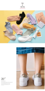 Detailed embroidery of cat motifs on the heels of colorful low-cut cotton ankle socks