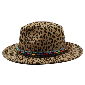 Detailed view of leopard print fedora hat featuring a colorful tribal beaded hatband