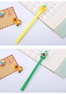 Detailed close-up of creative pineapple and avocado silicone topped pens on a desk