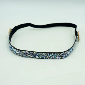 Elastic black button headband featuring iridescent rhinestones for ear protection and comfort