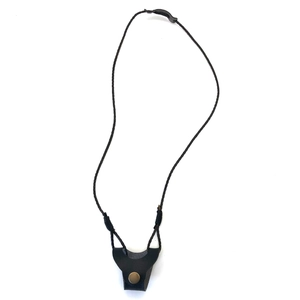 Detail of hand-woven black leather eyewear lanyard with vintage bronze metal buckle