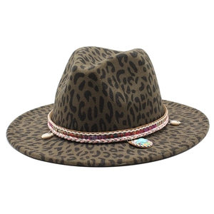 Detail of leopard print fedora with woven band, shell charms and teal gemstone pendant