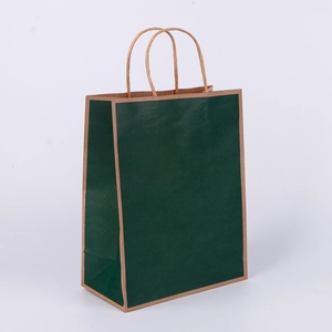 Detail of a dark green kraft paper shopping bag with sturdy twisted paper handles