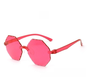 Detailed close-up of pink rimless sunglasses with unique wavy cut polygon lenses