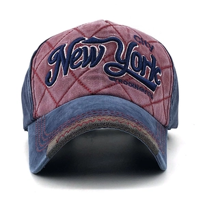 Close-up of quilted red and navy baseball cap with New York City embroidery
