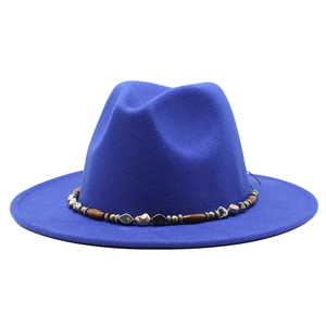 Detail of royal blue wool fedora with bohemian beaded band and wood accents