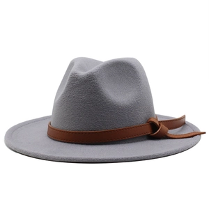 Detail of grey wool felt fedora hat featuring a brown leather decorative buckle band