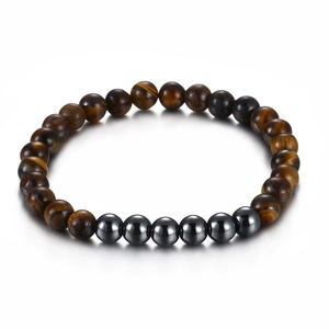 Minimalist tiger eye bead bracelet with grey stainless steel spheres on white background