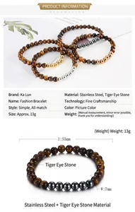 Detail view of 7mm tiger eye beads and stainless steel spacers on elastic bracelet