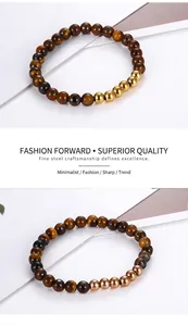 Detailed view of tiger eye stone beads and polished metallic steel beads on bracelets