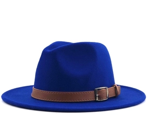 Detail of royal blue felt fedora hat with brown leather strap and metal buckle closure