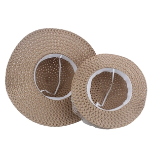 Matching parent-child straw hats with lace bow and windproof straps for summer beach holidays