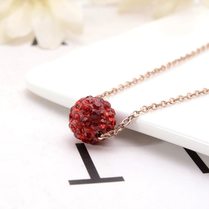 Fashionable rose gold necklace featuring a sparkling red crystal pavé ball pendant