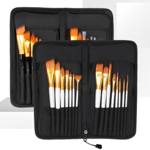 Detail of professional art brush set with white handles and orange nylon bristles in a case