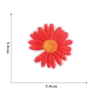 Close-up of a red daisy embroidered flower patch showing 5.0cm size measurement
