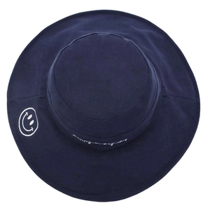 Detail of navy blue sun hat with white embroidered smile and script text on wide brim
