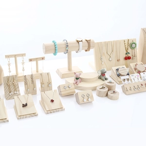 Solid wood jewelry display set with necklace stands and earring holders in natural pine finish