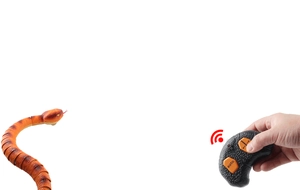Detail showing hand-held remote control guiding a realistic moving orange toy snake