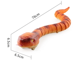 Detail view of orange remote control snake toy showing scale texture and 76cm length segments