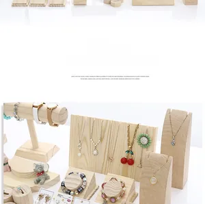 Macro detail of solid wood jewelry display stands showing natural grain and texture