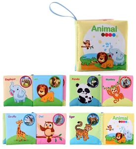 Detail view of animal cloth book pages with elephant and lion cartoon prints for toddlers