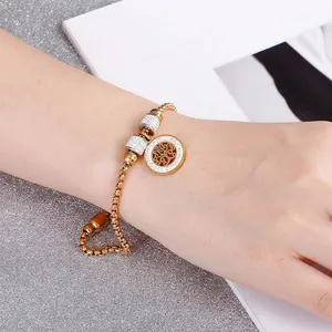 Golden Tree of Life bracelet for women with crystal charms and sparkling rhinestones