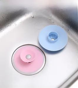 UFO silicone sink strainer in blue and pink for bathroom hair catching and water sealing