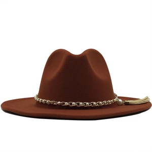 Detailed texture of brown wool fedora hat featuring pearl chain and tassel accents
