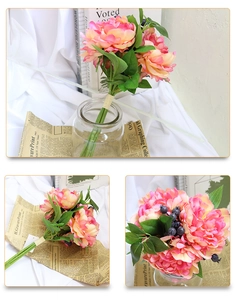 Detailed view of pink peony artificial flowers with blue berries and French vintage decor
