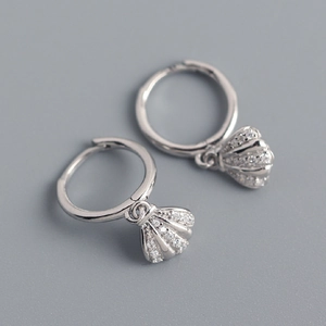 Detail view of S925 sterling silver shell earrings with sparkling zircon inlay