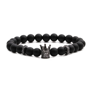 Men's matte black beaded crown bracelet with micro-pave zircon charms on white background