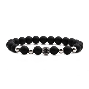 Matte black stone beaded bracelet with silver accents and a micro-pave zircon ball