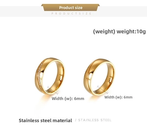 Close-up of 6mm gold stainless steel engagement rings with sparkling crystals and grooves