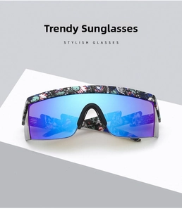 Detail of lightning temples and graffiti print on large frame blue cycling sunglasses