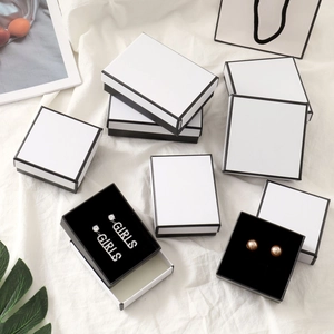 Elegant white jewelry box with black trim for necklaces earrings and rings display