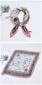 Detail of pleated square silk scarf featuring horse harness and chain patterns