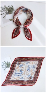 Detail of pleated silk scarf featuring vintage jewelry chain print in red and brown