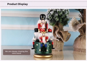 Close-up of hand-painted wooden nutcracker music box with festive Christmas base