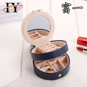 Detail view of portable jewelry box with built-in mirror and velvet ring organizer