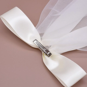 Elegant white tulle bridal veil with bow ribbon tassel and metal duckbill clip