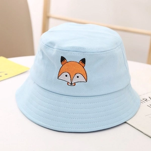 Detailed close-up of cute fox embroidery on light blue canvas baby bucket sun hat