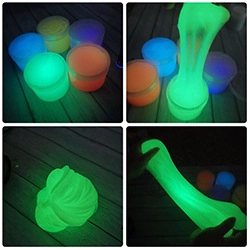 Luminous slime in colorful jars glowing brightly in the dark for creative sensory fun