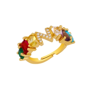 Detail of adjustable gold ring with colorful zircon stones and crystal letter Z motif