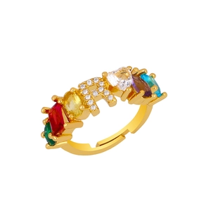 Detail of adjustable gold ring featuring letter R with colorful CZ stones and crystals