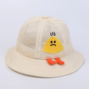 Detail view of breathable mesh texture and cartoon triangle decor on children's sun hat