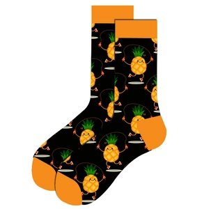 Detail view of cotton crew socks with funny pineapple jumping rope pattern in black and orange