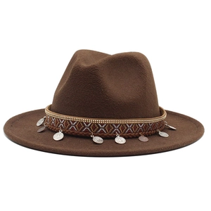 Detail of dark brown wool fedora hat with ethnic woven band and retro metal coin charms