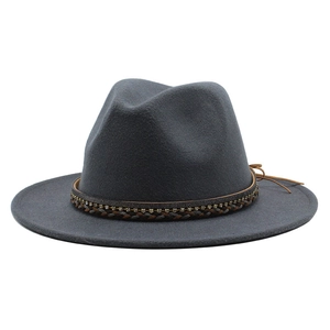 Detailed close-up of dark grey wool felt fedora with woven rhinestone band and leather tie